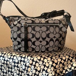 small coach bag coach symbols all over the back